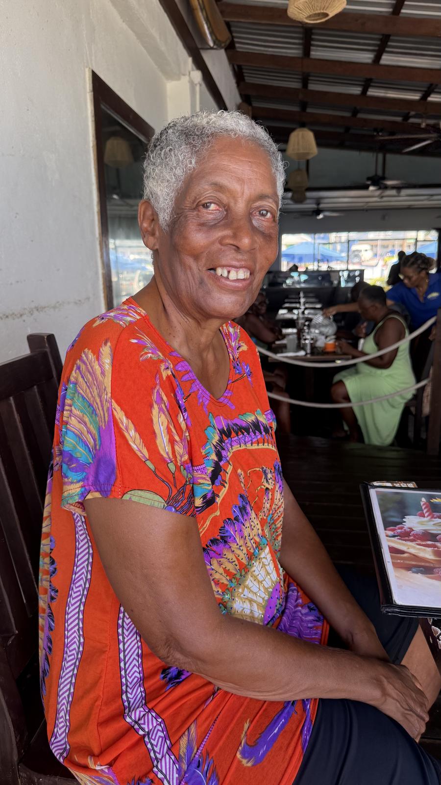 Monica in a bright patterned dress