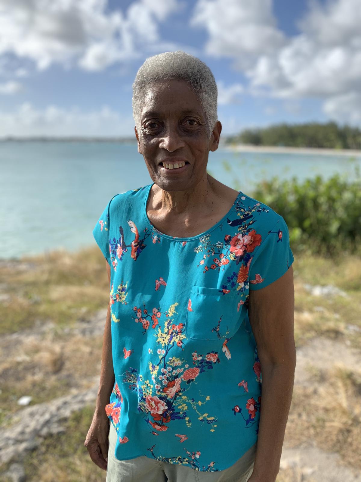Monica by the sea in a teal floral top